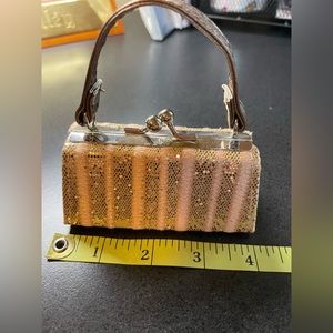 Tiny little purse. Super cute, brand new.